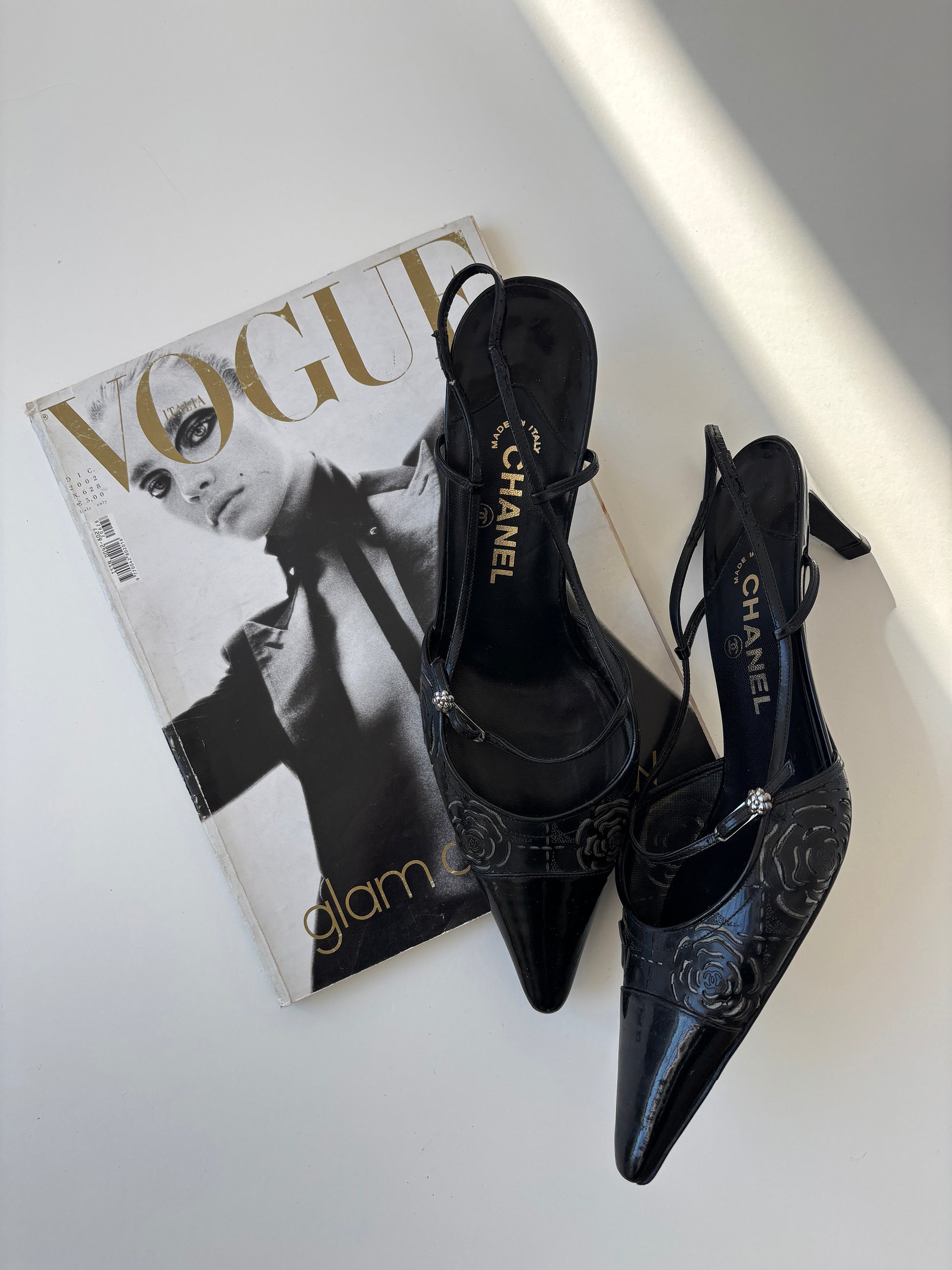 Vintage Chanel by Karl Lagerfeld 2000s black sling back kitten heels with roses cutouts.