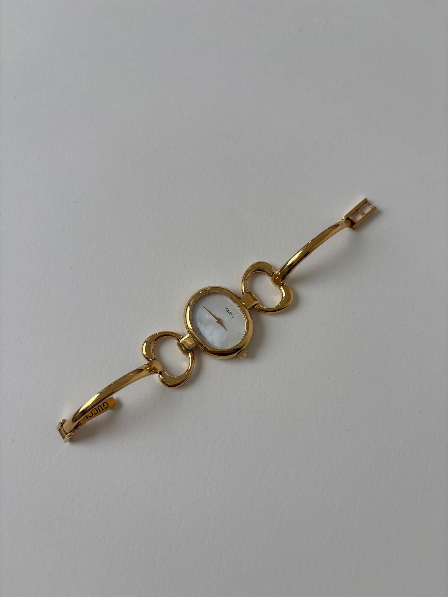 Gucci 1990s 18K gold plated mother of pearl bangle watch