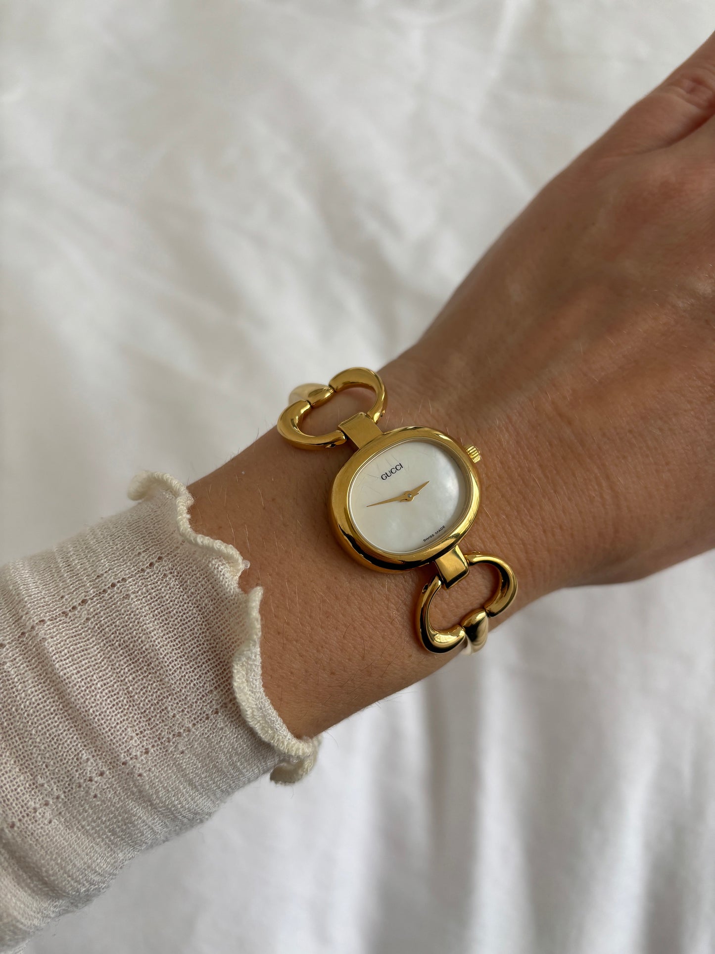 Gucci 1990s 18K gold plated mother of pearl bangle watch