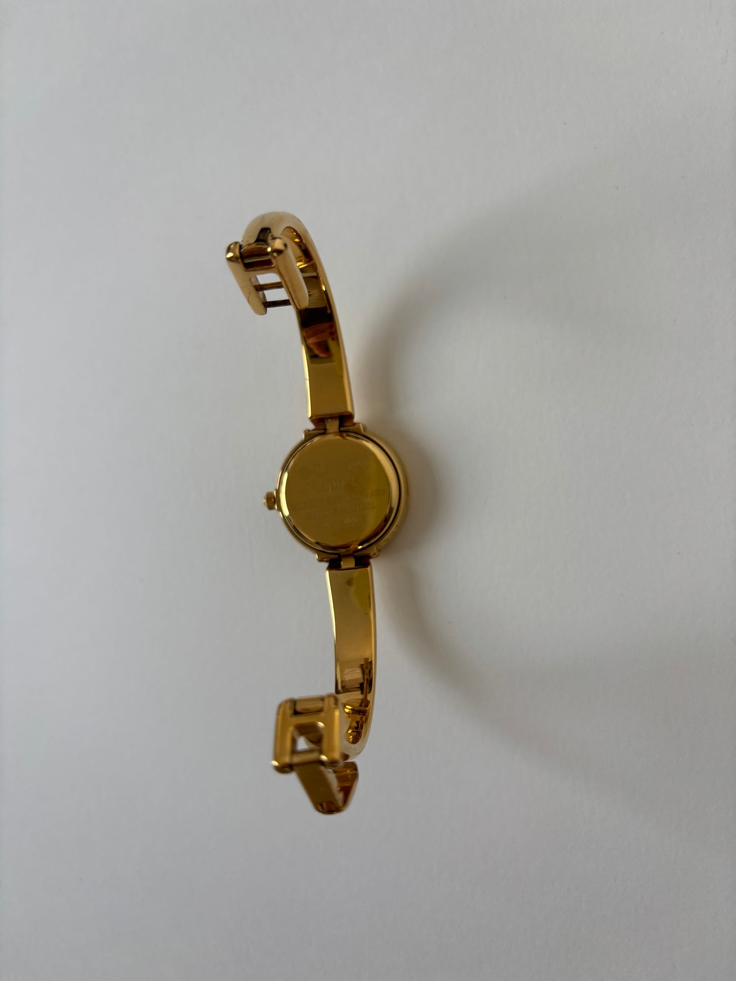 Gucci by Tom Ford 1990s 1400L 18K gold plated bangle watch