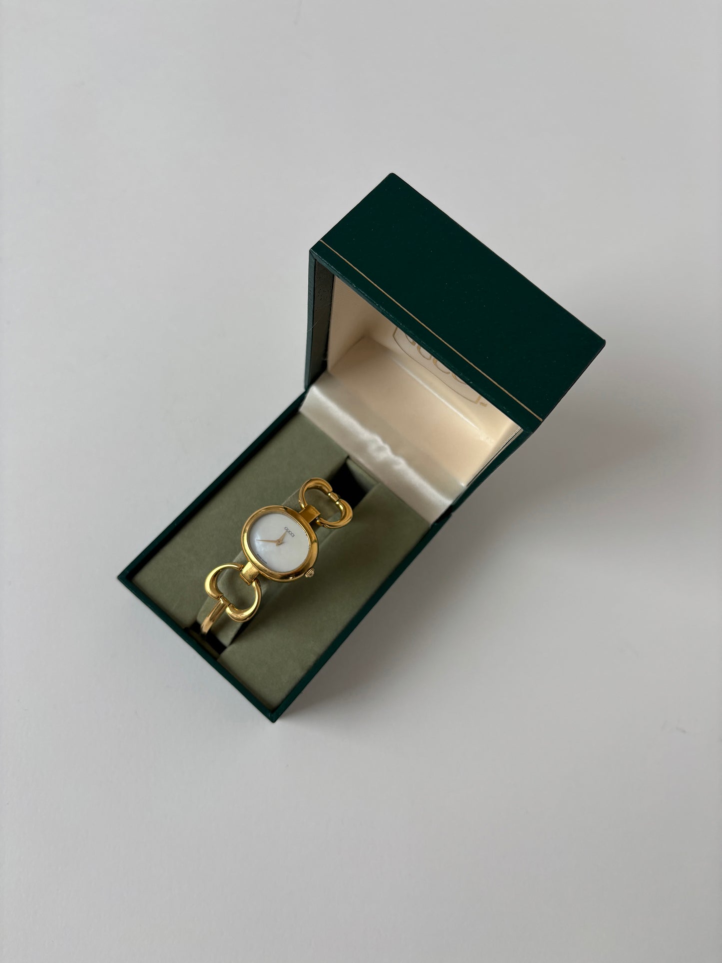 Gucci 1990s 18K gold plated mother of pearl bangle watch