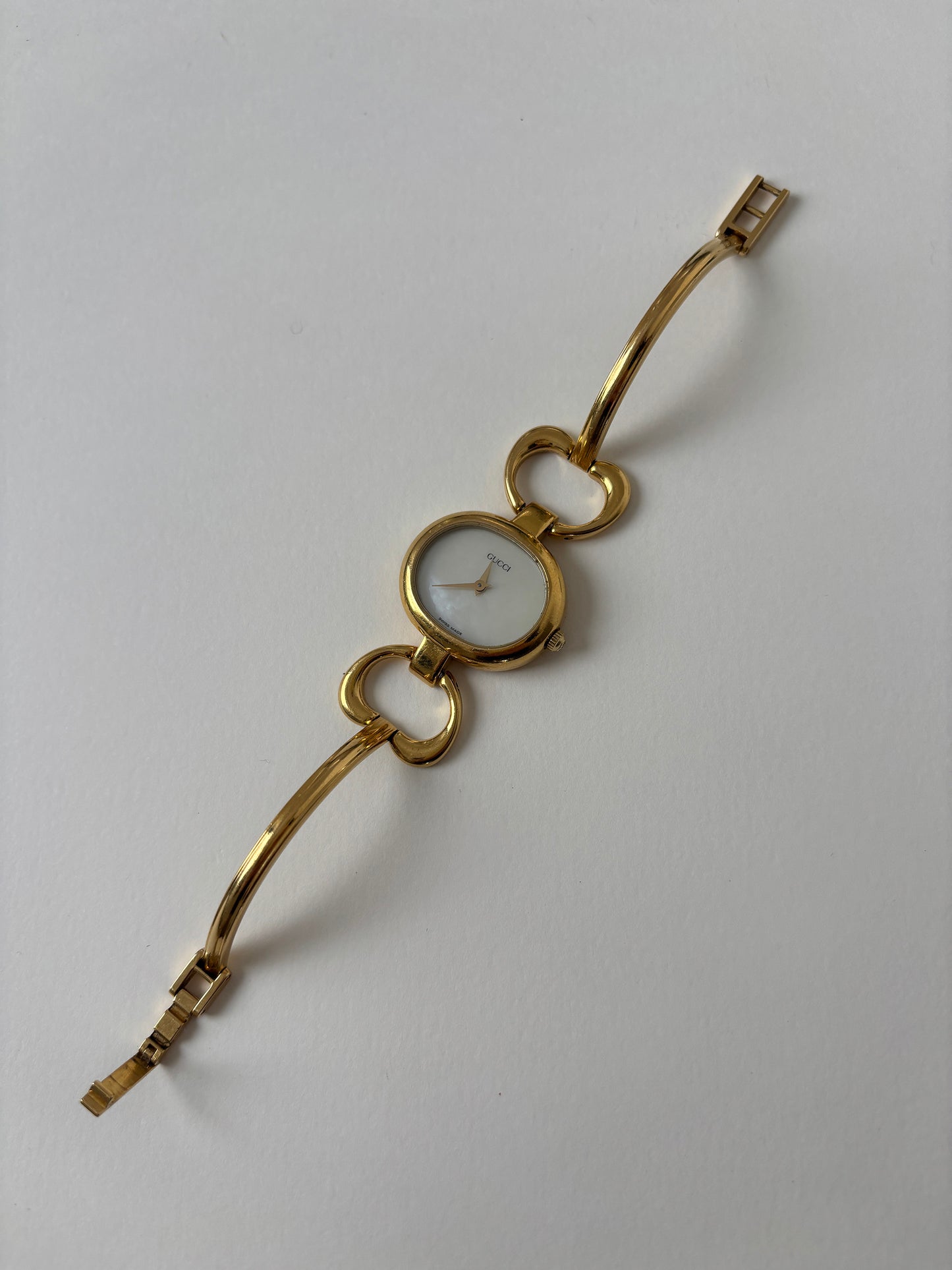 Gucci 1990s 18K gold plated mother of pearl bangle watch